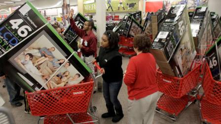 Early bird shoppers snatch up flat screen televisions at the Target store in Mayfield Hts., Ohio in the early hours of Friday, Nov. 25, 2011. Black Friday began in earnest as Target, Abercrombie and Fitch and other stores opened their doors at midnight. (AP Photo/Amy Sancetta)