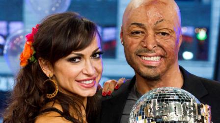 Karina Smirnoff, left, and J.R. Martinez winners of the Dancing with the Stars celebrity dance competition, appear on Good Morning America in New York, Wednesday, Nov. 23, 2011. (AP Photo/Charles Sykes)