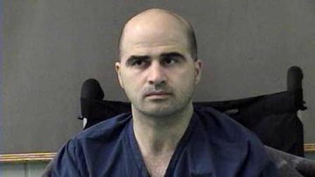 This April 9, 2010, file photo provided by the Bell County Sheriffs Department shows U.S. Major Nidal Hasan at the Bell County Jail in Belton, Texas. A military judge was expected to rule Wednesday, Nov. 30, 2011 on whether the government should pay for two defense experts on behalf of Hasan, charged in the Fort Hood shooting rampage.