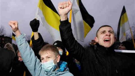 Russian nationalists shout holding old Russian imperial flags during their rally in St.Petersburg, Russia, Sunday, Dec. 11, 2011. Russian nationalists are rallying in Moscow and St.Petersburg, demanding a bigger say for ethnic Russians in the countrys politics and marking the first anniversary of a violent nationalist riot just outside the Kremlin.