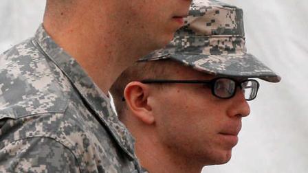 Army Pfc. Bradley Manning, right, is escorted into a courthouse at Fort Meade, Md., Sunday, Dec. 18, 2011, for a military hearing that will determine if he should face court-martial for his alleged role in the WikiLeaks classified leaks case.