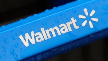 FILE - This photo taken Nov. 14, 2011, shows the rain-soaked handle of a shopping cart outside the Wal-Mart store in Mayfield Hts. Wal-Mart has pulled a batch of powdered infant formula from more than 3,000 of its stores nationwide after a newborn Missouri boy who was given the formula became gravely ill with a suspected bacterial infection and died after being taken off life support, the retailer said Wednesday, Dec. 21, 2011. (AP Photo/Amy Sancetta, File)