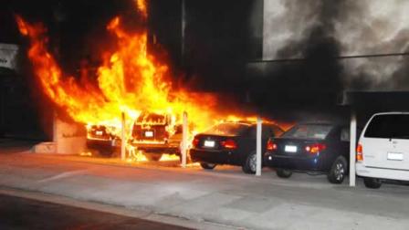 Burning cars are shown at the site of an arson fire in the Hollywood section of Los Angeles on Friday Dec.30, 2011. An arsonist torched car after car early Friday