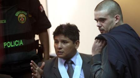 Joran Van der Sloot, right, stands with his lawyer Jose Jimenez after his murder trial was postponed in a courtroom at the San Pedro prison in Lima, Peru, Friday, Jan. 6, 2012. Dutch citizen Joran van der Sloot asked for more time Friday to decide how to plead in his trial for the 2010 murder of a 21-year-old Peruvian woman. His case was postponed until Jan. 11. (AP Photo/Karel Navarro)