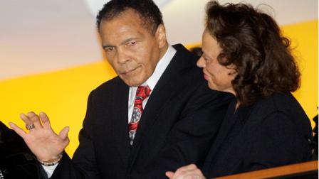Boxing great Muhammad Ali, with his wife, Lonnie, right, waves to friends attending a celebration for his 70th birthday at the Muhammad Ali Center on Saturday, Jan. 14, 2012, in Louisville, Ky. Ali turns 70 Tuesday. (AP Photo/Mark Humphrey)