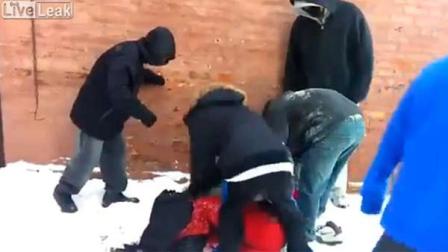 Footage of attackers brutally beating and robbing an Asian teen behind a Chicago school has gone viral on YouTube.