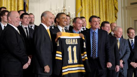 President Barack Obama honors the 2010-2011 Stanley Cup champion Boston Bruins hockey team, Monday, Jan. 23, 2012, in the East Room of the White House in Washington. From left are, coach Claude Julien, team owner Jeremy Jacobs, and the president (AP Photo/Susan Walsh)