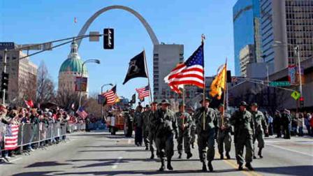 Participants in a parade to honor Iraq War veterans make their way along a downtown street Saturday, Jan. 28, 2012, in St. Louis. Thousands turned out to watch the first big welcome home parade in the U.S. since the last troops left Iraq in December.