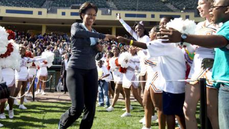 First lady Michelle Obama greets kids as she arrives for physical activity with kids at the ESPN Wide World of Sports Complex at the Walt Disney World Resort, Saturday, Feb. 11, 2012, in Orlando, Fla., during her three day national tour celebrating the second anniversary of Lets Move. (AP Photo/Carolyn Kaster)