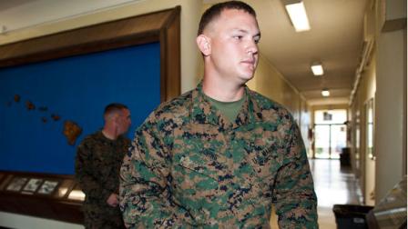FILE - In a Monday, Jan. 30, 2012 file photo, Marine Sgt. Benjamin Johns walks to the courtroom of the Legal Services Center of Marine Corps Base Hawaii, in Kaneohe Bay, Hawaii. Lance Cpl. Jacob D. Jacoby, Johns, and Lance Cpl. Carlos Orozco III are accused of hazing fellow Marine Lance Cpl. Harry Lew, who later committed suicide. (AP Photo/Kent Nishimura, File)