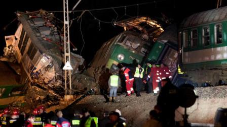 Rescue officials work at the scene where two trains collided in Szczekociny, southern Poland, killing several people and injuring dozens of others, Saturday evening, March 3, 2012. The head-on collision appears to be one of the worst rail disasters in the country in recent years, officials said. (AP Photo/ Michal Legierski )