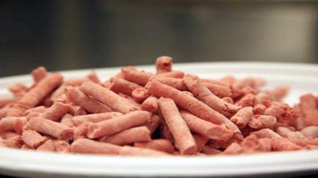 In this undated image released by Beef Products Inc., boneless lean beef trimmings are shown before packaging. The debate over pink slime in chopped beef is hitting critical mass. The term, adopted by opponents of lean finely textured beef, describes the processed trimmings cleansed with ammonia and commonly mixed into ground meat. Federal regulators say it meets standards for food safety. Critics liken it to pet food _ and their battle has suddenly gone viral amid new media attention and a snowballing online petition.