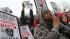 Demonstrators pray during the Million Hoodie...