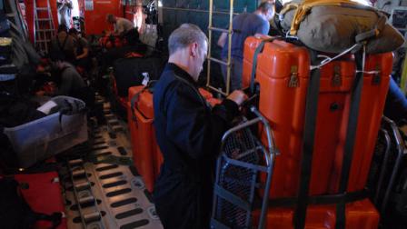 In this image provided by the U.S. Coast Guard Air National Guard parajumpers, from the 129th Rescue Wing prepare medical supplies to be dropped from a Coast Guard aircraft to a 67-foot sailing yacht with three injured persons aboard, the Clipper Venture Six which is sponsored by Geraldton Western Australia, in the Round the World Yacht Race, Saturday, March 31, 2012. The Coast Guards Rescue Coordination Center in Alameda, Calif. is coordinating the efforts to rescue the three injured persons 400 miles west of San Francisco. (AP Photo/Seaman David Flores, U.S. Coast Guard)