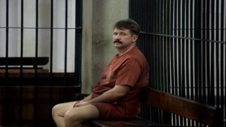 Alleged Russian arms dealer Viktor Bout looks on while sitting in custody at criminal court in Bangkok, Thailand Monday, Sept. 22, 2008. Bouts extradition hearing to the United States started Monday, after a string of delays in the high-profile case because of complications with his defense team in Thailand. Bout, dubbed The Merchant of Death, has been indicted in the U.S. on four terrorism charges. He was arrested in Thailand on March 6.