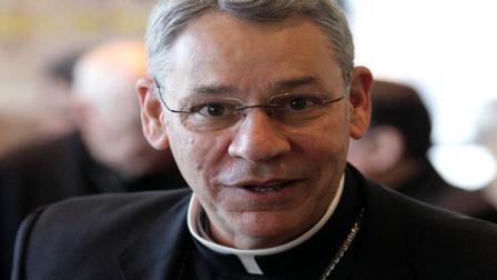 Bishop Robert Finn, of Kansas City, Mo., leaves a meeting at the United States Conference of Catholic Bishops annual fall assembly in Baltimore, Monday, Nov. 14, 2011. Finn was indicted in October for waiting five months to tell police about hundreds of images of alleged child pornography that were found on a priests computer. He is the highest-ranking church member in the sex abuse scandal to face criminal charges.