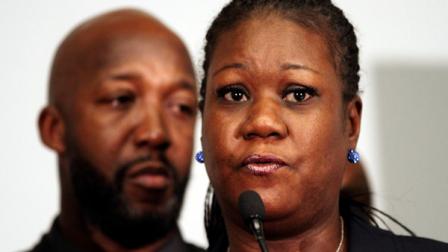 Trayvon Martins parents Tracy Martin, left, and Sybrina Fulton, speak to the media about the arrest of George Zimmerman for the killing of Trayvon Martin, at the Washington Convention Center in Washington, on Wednesday, April 11, 2012. (AP Photo/Jacquelyn Martin)