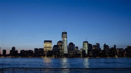 One World Trade Center towers above the Lower Manhattan skyline and Hudson River, Monday, March 26, 2012, in New York. The tower, now up to 93 floors, will reach 104 floors and is scheduled for completion in 2013.