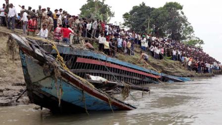 Rescuers pull out the wreckage of a ferry that capsized in the Brahmaputra River at Buraburi village, about 350 kilometers (215 miles) west of the state capital Gauhati, India, Tuesday, May 1, 2012. Army divers and rescue workers pulled more than 100 bodies out of a river after a packed ferry capsized in heavy winds and rain in remote northeast India, an official said Tuesday. At least 100 people were still missing Tuesday after the ferry carrying about 350 people broke into two pieces late Monday, said Pritam Saikia, the district magistrate of Goalpara district.