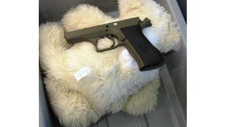 This undated photo provided by the federal Transportation Security Administration shows pistol parts hidden in a stuffed animal found by TSA officials at T.F. Green Airport in Warwick, R.I., Monday May 7, 2012. (AP Photo/Transportation Security Administration)