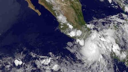 This image provided by NASA acquired Friday at 11 p.m. EDT shows Hurricane Carlotta slammed into Mexicos resort-studded Pacific coast late Friday, toppling trees and lashing hotels while authorities evacuated people from low-lying areas. The rapidly changing hurricane made landfall as a Category 1 storm near Puerto Escondido, a laid-back port popular with surfers, and is expected to push inland and northward in the direction of Acapulco. (AP Photo/NASA)