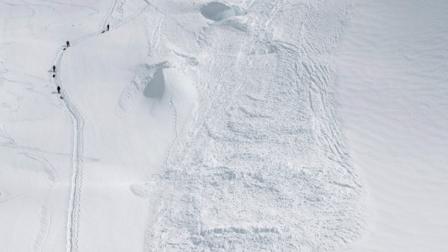 In this Friday, June 15, 2012 photo provided by the National Park Service, climbers hike through the area where an avalanche swept a Japanese climbing team off a hill during their descent from Alaskas Mount McKinley. U.S. National Park Service officials say five people were traveling as a one rope team early Thursday morning as part of a Miyagi Workers Alpine Federation expedition on the Alaska mountain. The NPS said Hitoshi Ogi, 69, survived after falling 60 feet (18 meters) into a crevasse. He was able to climb out. The other four tumbled into the avalanche debris and havent been seen since. (AP Photo/National Park Service, Kevin Wright)