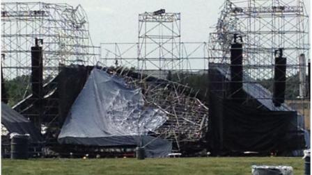 This photo provided by Alexandra Mihan shows a collapsed stage at the site for a Radiohead concert at Downsview Park in Toronto on Saturday June 16, 2012. Toronto paramedics say one person is dead and another is seriously hurt after the stage collapsed while setting up for a Radiohead concert. They say two other people were injured and are being assessed. (AP Photo/Alexandra Mihan via The Canadian Press)