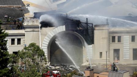 Firefighters with the San Francisco Fire Department battle a fire at Pier 29 on the waterfront in San Francisco, Wednesday, June 20, 2012. Fire Department spokeswoman Mindy Talmadge says more than 100 firefighters are trying to surround the fire and drown it out. Talmadge says no injuries have been reported. (AP Photo/Jeff Chiu)