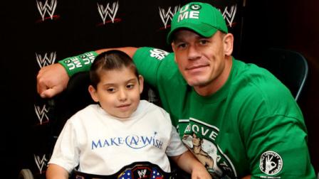 In this Monday, June 18, 2012 photo, seven-year old, Jonny Littman, poses with WWE superstar, John Cena, at the 300th Make-A-Wish for Cena in Uniondale, N.Y. It was the 300th wish granted by Cena, making him the most popular celebrity granter in Make-A-Wish history. (AP Photo/John Carucci)