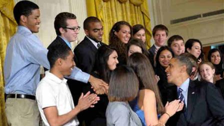 President Barack Obama greets students after he called on Congress to stop interest rates on student loans from doubling next month during a news conference in the East Room of the White House in Washington, Thursday, June 21, 2012. (AP Photo/Susan Walsh)