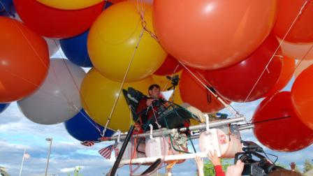 FILE- This July 5, 2008, file photo shows Kent Couch lifting off from his gas station in Bend, Ore., riding a lawn chair rigged with more than 150 giant party balloons for a flight that ended 235 miles away in an Idaho farm field. Couch plans to fly again July 14, this time with Iraqi adventurer Fareed Lafta in a tandem rig they hope will go 400 miles to Montana. It is a warm-up for a flight planned for this fall in Iraq. (AP Photo/Jeff Barnard, File)