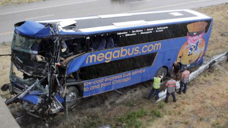 The wreckage of a Megabus is removed from the bridge support pilar that it slammed into after blowing a tire, Thursday, Aug. 2, 2012 in Litchfield, Ill. Illinois State Police Trooper Doug Francis said at least one person was killed in the afternoon wreck which was traveling from Chicago to Kansas City. He didnt immediately have other details about the death. (AP Photo/Tom Gannam)