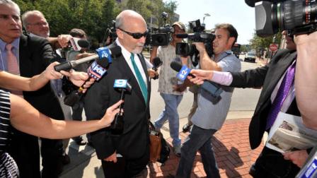 Drew Peterson lead defense attorney Joel Brodsky leaves the Will County Courthouse in Joliet, Ill. after the second day of the murder trial of Peterson. Peterson, 58, is charged with killing his third wife, Kathleen Savio, in 2004. Her body was found in a dry bathtub in her home, her hair soaked with blood. He is also a suspect in the 2007 disappearance of his fourth wife, Stacy Peterson. (AP Photo/Paul Beaty)
