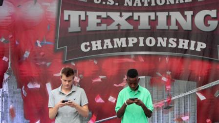 Austin Wierschke, left, of Rhinelander, Wis., and Kent Augustine, of Jamaica, N.Y., compete during the final round of the 2012 LG U.S. National Texting Championship , Wednesday, Aug. 8, 2012 in New York. (AP Photo/Mary Altaffer)