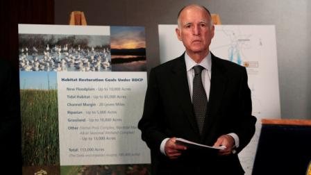 Gov. Jerry Brown waits for the start of a news conference to announce plans to build a giant twin tunnel system to move water from the Sacramento-San Joaquin River Delta to farmland and cities, at a news conference in Sacramento, Calif., Wednesday, July 25, 2012. The Bay Delta Conversation Plan, is estimated to cost about $23.7 billion, with the $14 billion cost to build the giant tunnels paid by the water users, and $10 billion for habitat restoration.(AP Photo/Rich Pedroncelli)