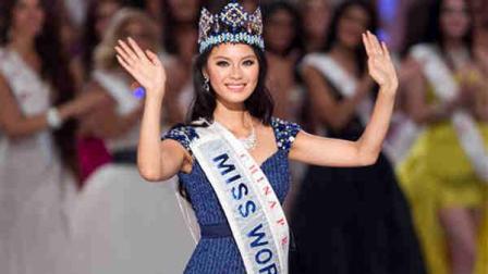 Newly crowned Miss World Yu Wenxia of China waves after she won the Miss World 2012 beauty pageant at the Ordos Stadium Arena in inner Mongolia, China Saturday, Aug. 18, 2012. (AP Photo/Andy Wong)