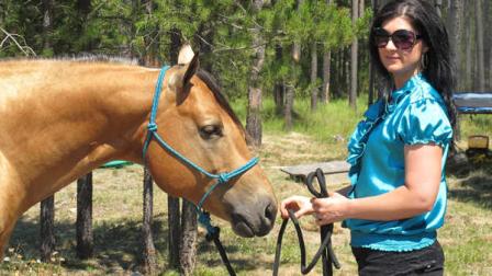 This photo taken Aug. 7, 2012 shows Sara Weaver at her horse at her ranch outside Kalispell, Mont. Weaver has finally forgiven the federal agents who 20 years ago shot her mother and younger brother to death during the siege at Idahos Ruby Ridge. (AP Photo/Nicholas K. Geranios)