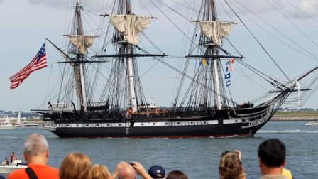 The USS Constitution is escorted by a tugboat in Boston Harbor as a crowd looks on from the shore in Boston, Sunday, Aug. 19, 2012. The USS Constitution, the U.S. Navys oldest commissioned war ship, sailed under her own power during the event Sunday for the first time since 1997. The sail was held to commemorate the 200th anniversary of the ships victory over HMS Guerriere in the War of 1812. (AP Photo/Steven Senne)