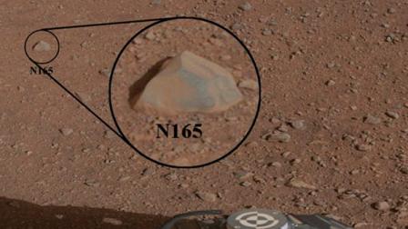 This image provided Sunday, Aug. 19, 2012, by NASA shows a close-up view of a Martian rock that the NASA rover Curiosity zapped at using its laser instrument. Curiosity landed on in a giant crater near Mars equator on Aug. 5, 2012 on a two-year mission to determine whether the environment was habitable. (AP Photo/NASA)