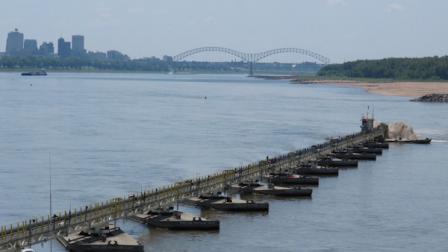 A pipeline connected to a dredge operated by the U.S. Army Corps of Engineers near Memphis, Tenn. spits sand toward the west bank of the Mississippi River on Monday, Aug. 20, 2012 near Memphis, Tenn. (AP Photo/Adrian Sainz)