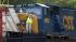 An official photographs derailed train cars...