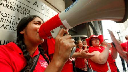 Chicago Teachers Union members picket prior to a Chicago Board of Education meeting on Wednesday, Aug. 22, 2012 in Chicago. The union called for fair contracts with higher pay for its teachers. (AP Photo/Sitthixay Ditthavong)
