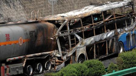 In this photo released by Chinas Xinhua News Agency, the burnt wreckage of a double-decker sleeper bus and a tanker loaded with highly-flammable methanol sit on a highway in Yanan City, northwest Chinas Shaanxi province on Sunday, Aug. 26, 2012. The 39-seat bus rammed into the tanker early Sunday, causing both vehicles to burst into flames and killing 36 people, state media said. (AP Photo/Xinhua, Li Yibo) NO SALES