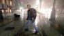 A man crosses Canal Street in the wind and rain from Hurricane Isaac Wednesday, Aug. 29, 2012, in New Orleans. 