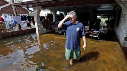 Peter Roccaforte reflects on the damage to his home caused by Hurricane Isaac in Reserve, La., Saturday, Sept. 1, 2012. Floodwaters cover many streets and power remains out in some areas. Louisianas Public Service Commission said more than 443,000 customers remained without electricity around Louisiana on Saturday morning, days after Isaac crept across the state. (AP Photo/David J. Phillip)