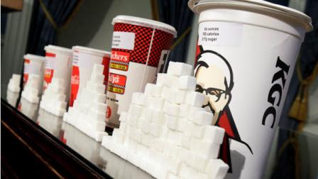 Various size cups and sugar cubes are displayed at a news conference at New Yorks City Hall, Thursday, May 31, 2012. (AP Photo/Richard Drew)