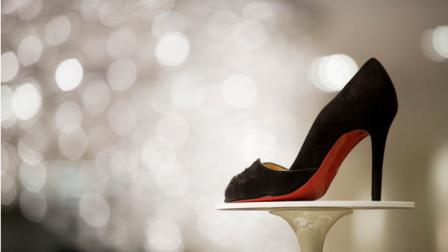 A stiletto-heeled shoe by Christian Louboutin is displayed at the opening of Saks Fifth Avenues designer shoe floor on Friday, Aug. 17, 2007 in New York. (AP Photo/Mark Lennihan)