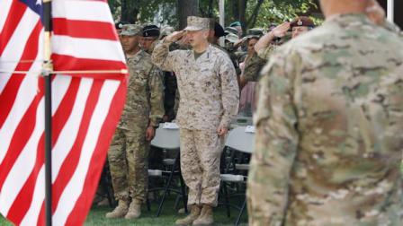 U.S. Marine Gen. John Allen, center, the top commander of U.S. and coalition troops in Afghanistan salutes during a ceremony marking the 11th anniversary of the Sept. 11 attacks, at the NATO headquarter in Kabul, Afghanistan, Tuesday, Sept. 11, 2012. (AP Photo/Ahmad Jamshid)