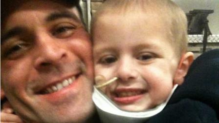 This undated photo provided by Dameon Burcie shows Dameon Burcie and his 4-year-old son Dyrk at a Dallas fire station. (AP Photo/Courtesy of Dameon Burcie, File)