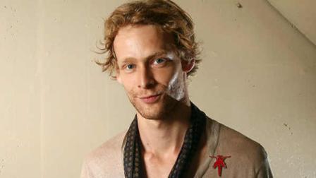 FILE - This Sept. 14, 2011 file photo shows actor Johnny Lewis posing for a portrait during the 36th Toronto International Film Festival in Toronto, Canada. Authorities say Lewis fell to his death after killing an elderly Los Angeles woman. Lewis appeared in the FX television show Sons of Anarchy, for two seasons. The woman killed is identified as 81-year-old Catherine Davis. (AP Photo/Carlo Allegri, file)
